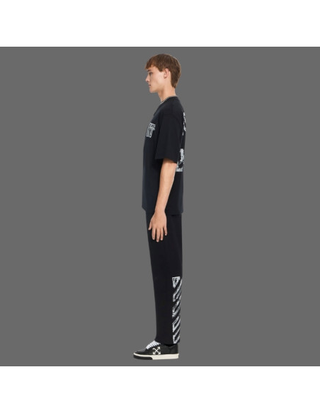 Pantalon De Survêtement Motion Arrow Noir Homme Off-White présenté porté de profil｜Magasin Homme Toulouse